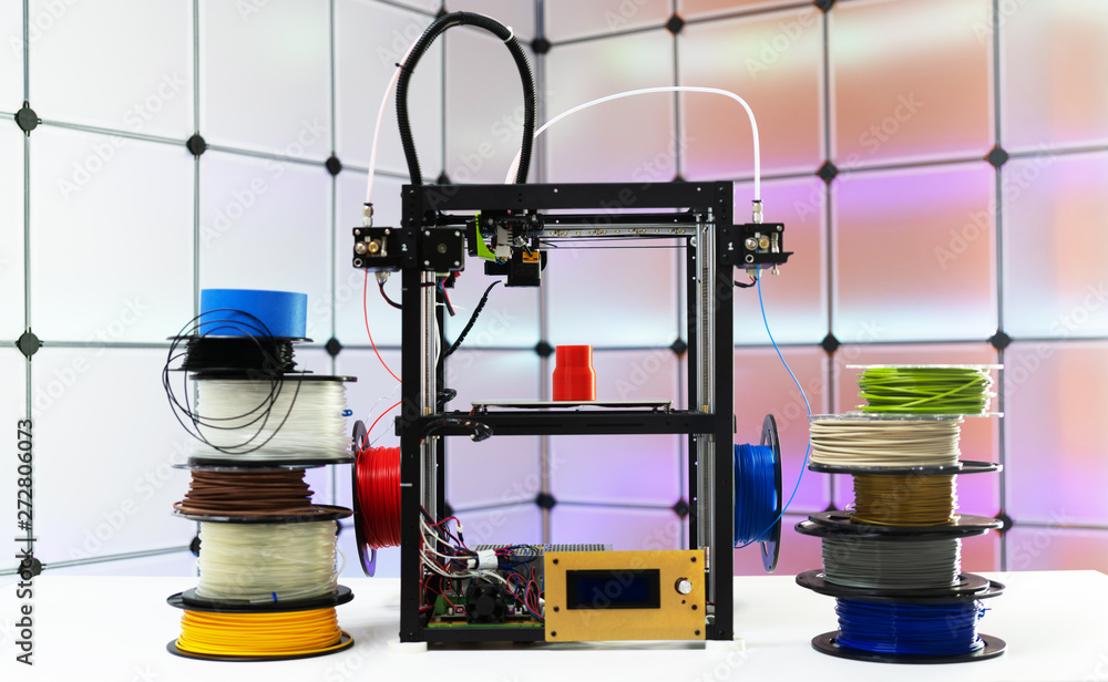3d printer and plastic filament on color background - obrazy, fototapety, plakaty 