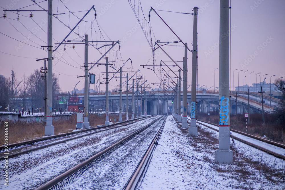 Winter Russian Railway. Public transport. winter road. Rails and sleepers. Electricity Winter Russian Railway. Public transport. winter road. Rails and sleepers. Electricity