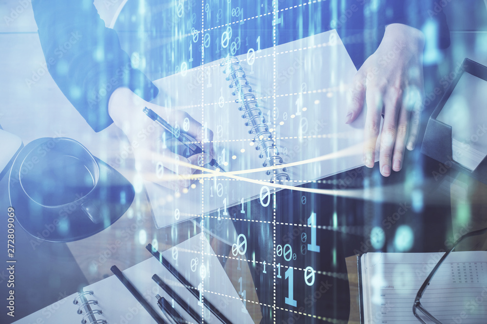 Double exposure of writing hands on background with data solution hologram on front. Technology concept. Close up