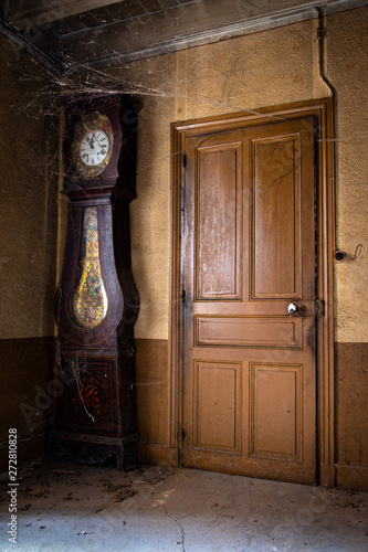 Door and grandfather clock from old french farmhouse