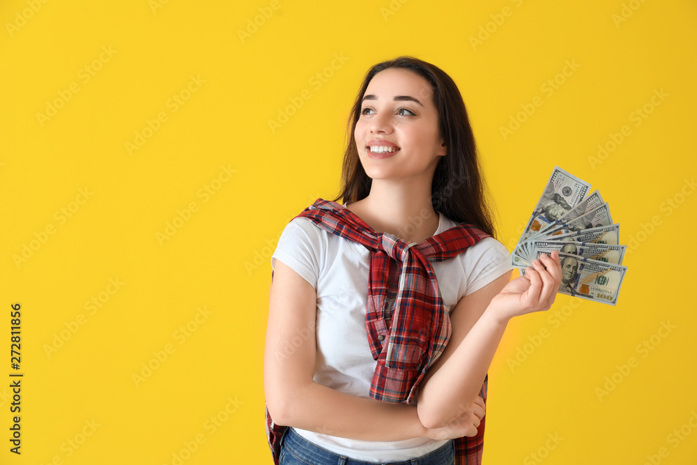 Happy young woman with dollar banknotes on color background Happy young woman with dollar banknotes on color background