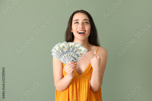 Happy young woman with doll...