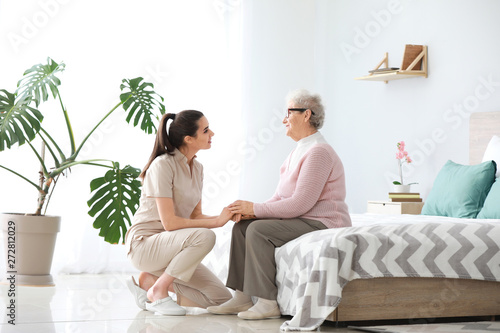 Caregiver with senior woman...