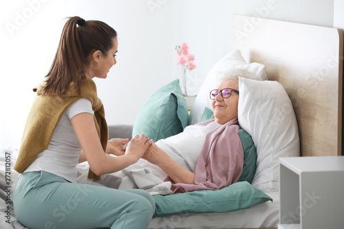 Caregiver with senior woman...