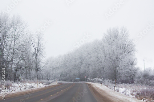 Winter Russian asphalt road. Winter road. Snowy road. Journey .