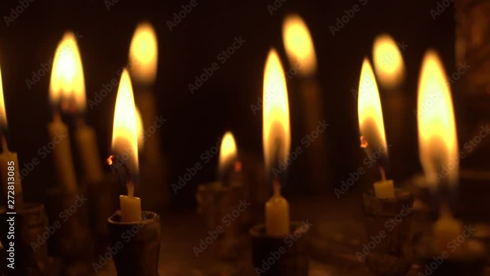 candles are lit on the candlestick in the church candles are lit on the candlestick in the church