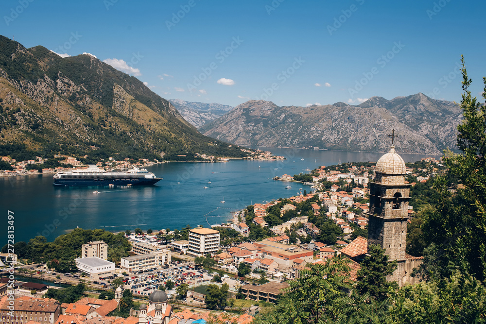 Montenegro Adriatic Sea and mountains. Picturesque panorama of the city of Kotor on a summer day. Panoramic view of the Bay of Kotor and the city. Cruise liner in the Bay of Kotor
