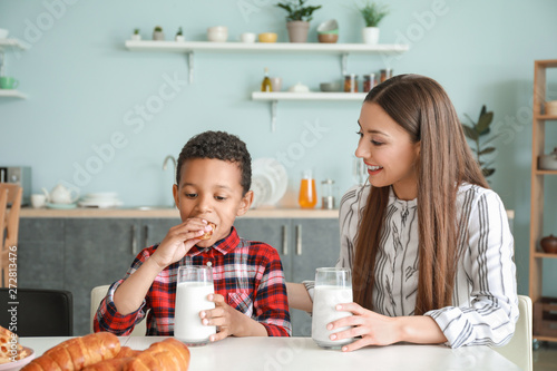 Young mother with adopted s...