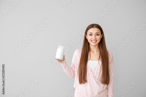 Beautiful woman with glass ...