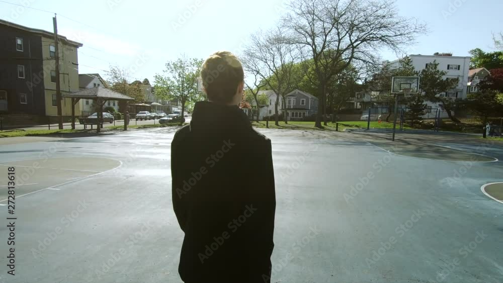 Young motivated girl is preparing for training at playground, heathy lifestyle, sport conception. Slowmotion. Handheld Young motivated girl is preparing for training at playground, heathy lifestyle, sport conception. Slowmotion. Handheld