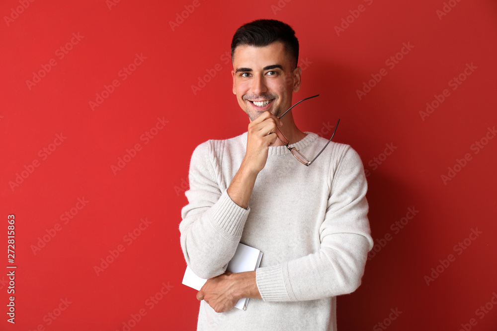 Handsome male teacher on color background Handsome male teacher on color background