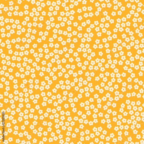 Seamless cream ditsy flowers on a yellow background.