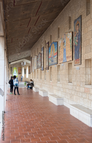 Donated icons on the walls in the courtyard of the Basilica of the Annunciation in the old city of Nazareth in Israel