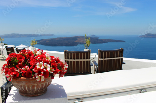 Santorini oia thira sun terrace with two chaise lounges and beautiful seascape. © VerAtro