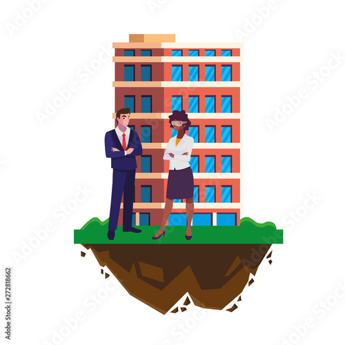 interracial business couple with building