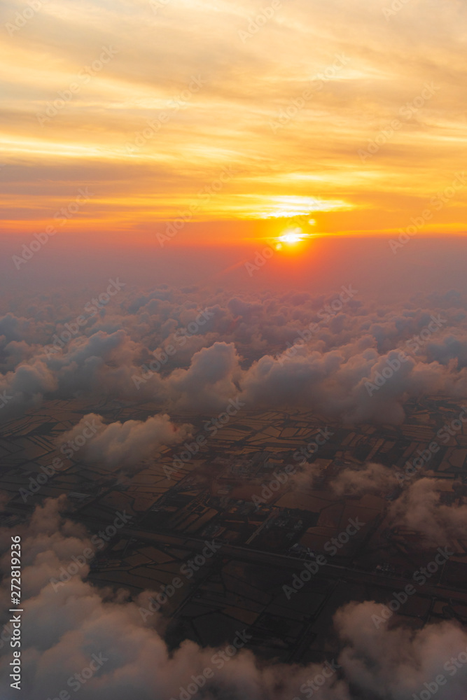 the sea of cloud sunset sky background from window airplane