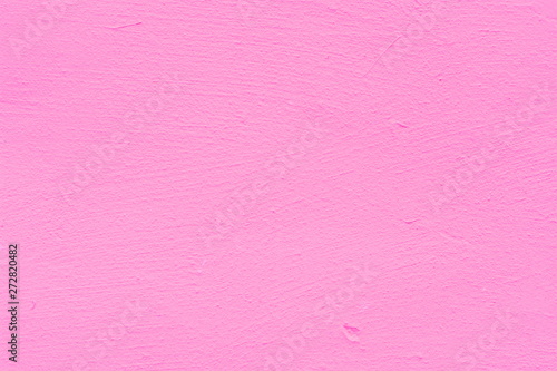 Background of a pink stucco coated and painted exterior, rough