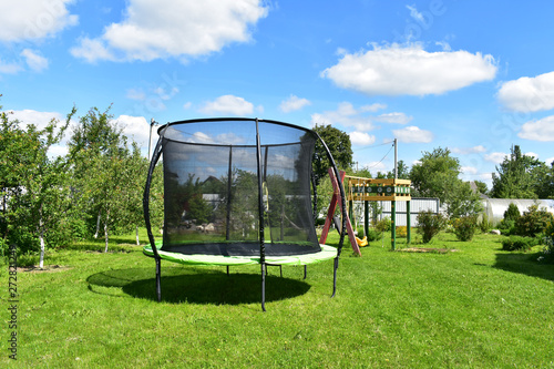 The trampoline on the background of nature.