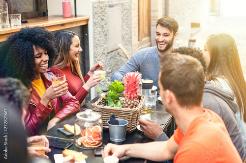 Photography Group of multiracial people having breakfast together in a coffee shop drinking coffee, cappuccino and fruit juice