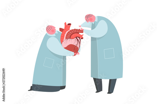 Doctors or scientist working on heart transplantation donor organ.