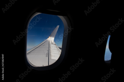 passenger seat with wing view of airplane