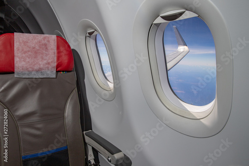 passenger seat with wing view of airplane