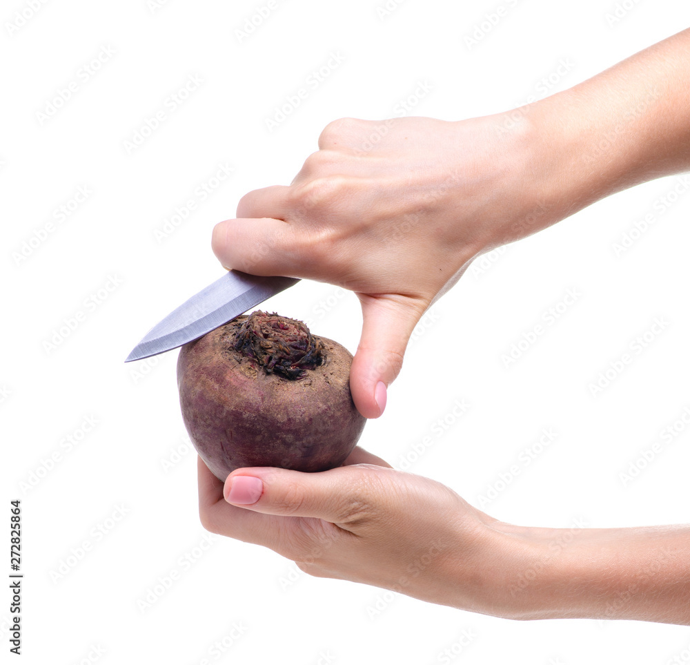 Red beet vegetable knife in hand on white background isolation