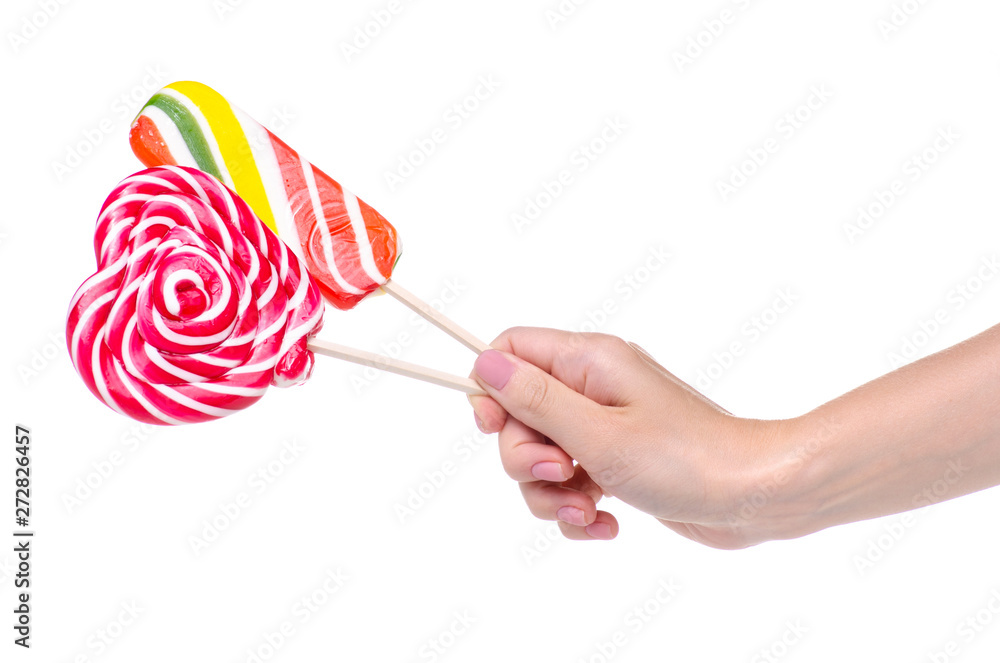 Candy lollipop colorful in hand on white background isolation Candy lollipop colorful in hand on white background isolation