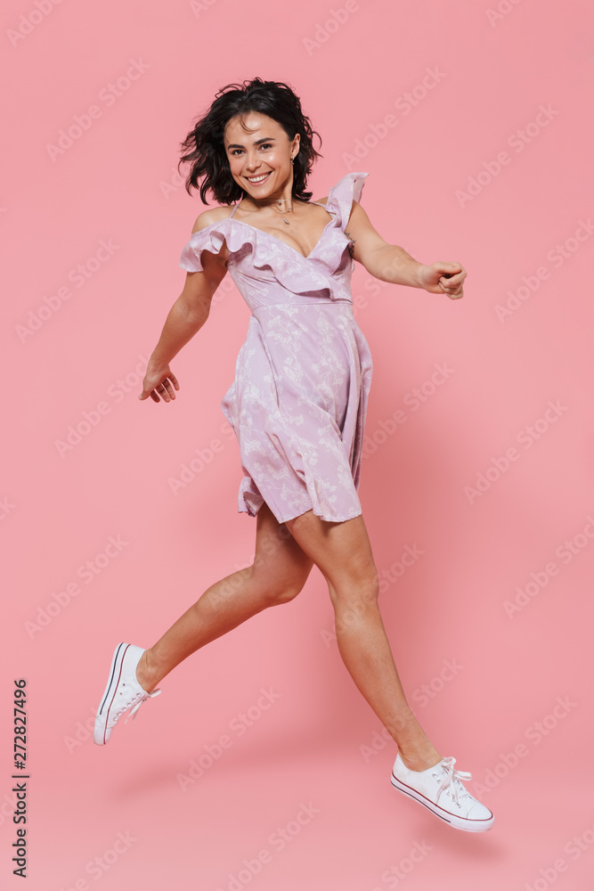 Full length of a smiling young girl wearing summer dress