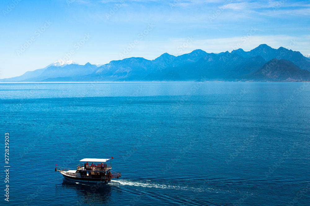 Beautiful landscape of mountains and ship in the Mediterranean sea in Turkey, Antalya. Beautiful landscape of mountains and ship in the Mediterranean sea in Turkey, Antalya.