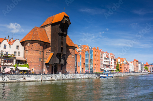 Old town of Gdansk with historical port crane reflected in Motlawa river, Poland