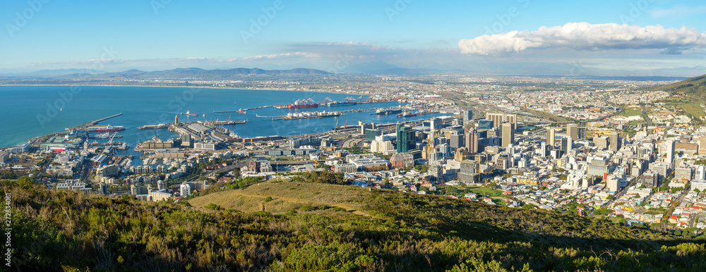 Amazing panoramic view of beautiful Cape Town from the slopes of Signal Hill showing v&a waterfront, harbour, business centre and, in the distance, the Cape Flats. Western Cape. South Africa