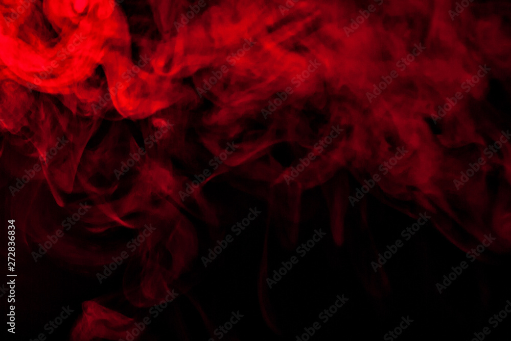 Obraz premium Red smoke on a black background. Texture