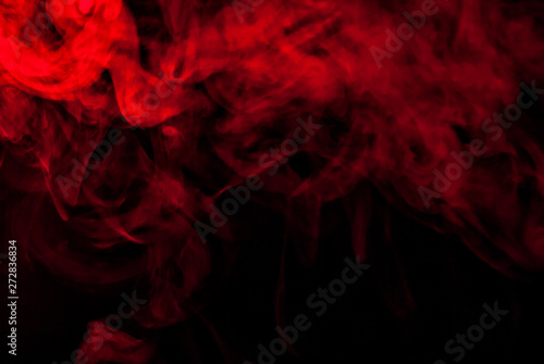 Red smoke on a black background. Texture