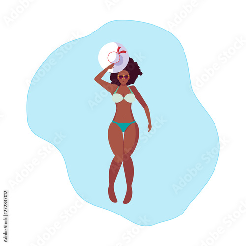 beautiful afro woman with swimsuit floating in water