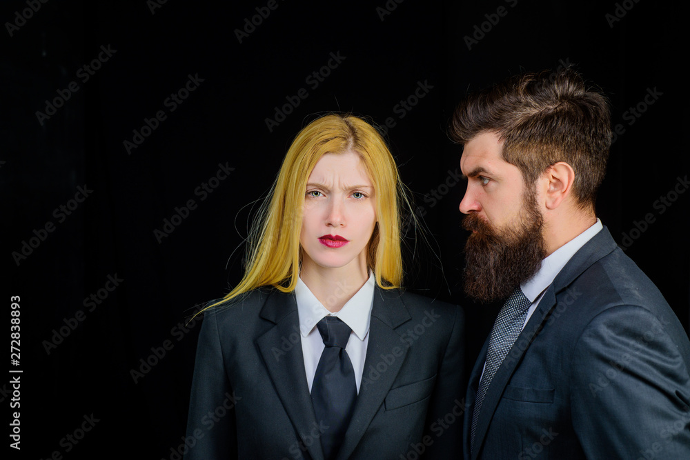 Businesswoman and businessman. Partnership in business. Serious businesspeople. Successful business people at office. Business couple in office. Business team woman and man. Leadership and cooperation Businesswoman and businessman. Partnership in business. Serious businesspeople. Successful business people at office. Business couple in office. Business team woman and man. Leadership and cooperation