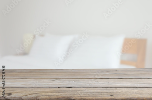 Fototapeta Naklejka Na Ścianę i Meble -  wood table top Pillows on bed