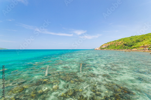 beautiful beach on the island like paradise and clear blue aqua sea water on summer background vacation in Thailand.