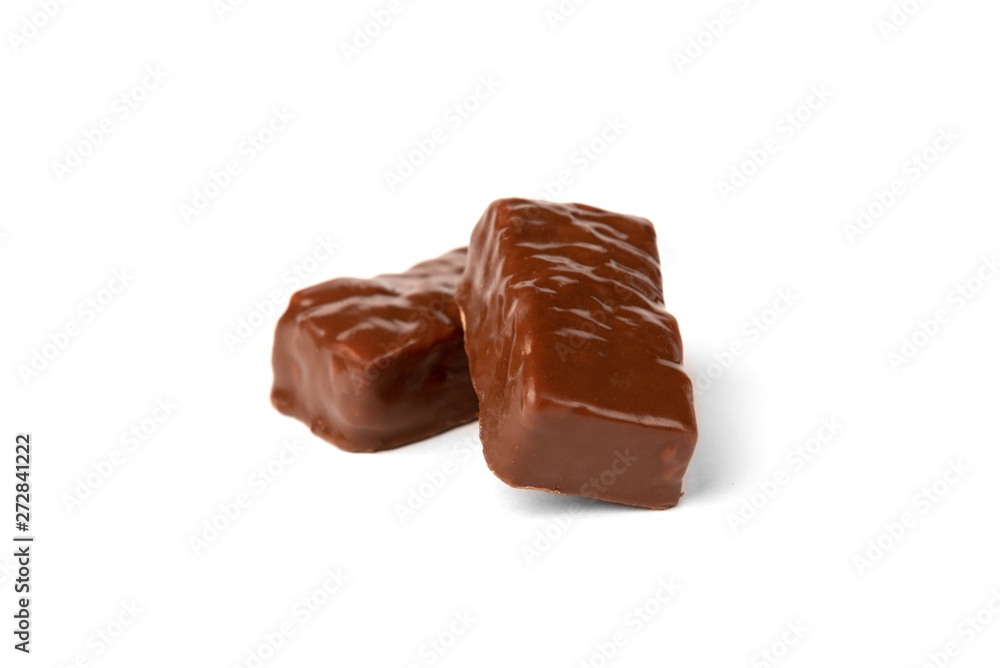 Chocolate sweet with caramel and peanut isolated on white background.