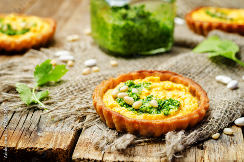 buckwheat tartlets with with white beans carrot hummus and cilantro pesto