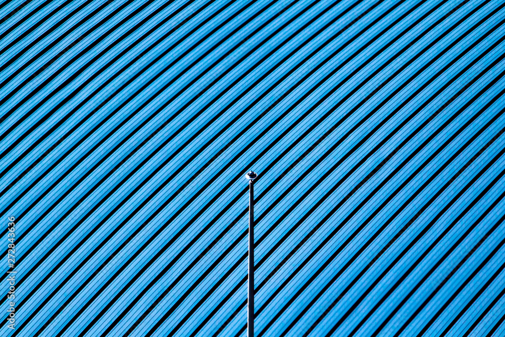 Obraz premium Abstract Geometric Architecture. Blue Roof with Angled Lines.