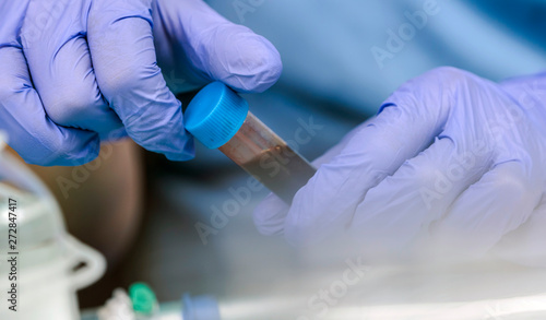 Nurse takes blood sample in hospital, conceptual image