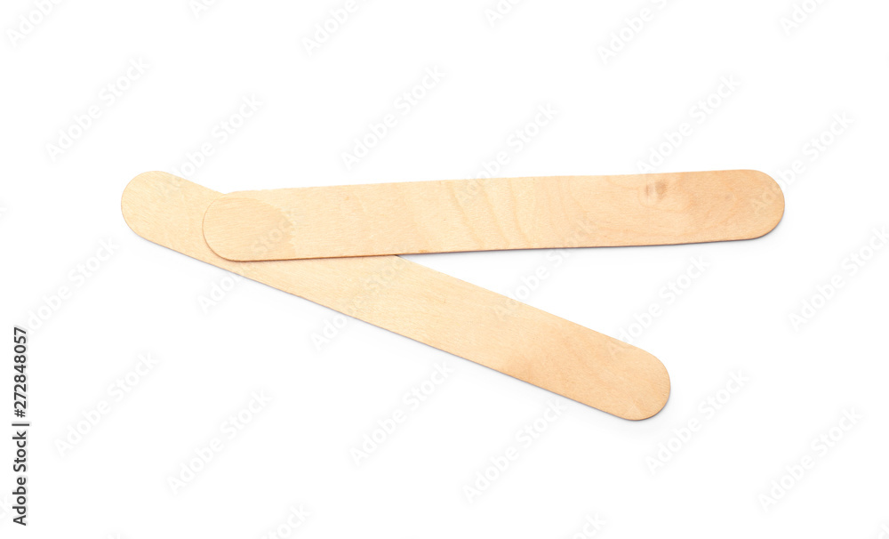 Empty wooden ice cream sticks on white background, top view Empty wooden ice cream sticks on white background, top view
