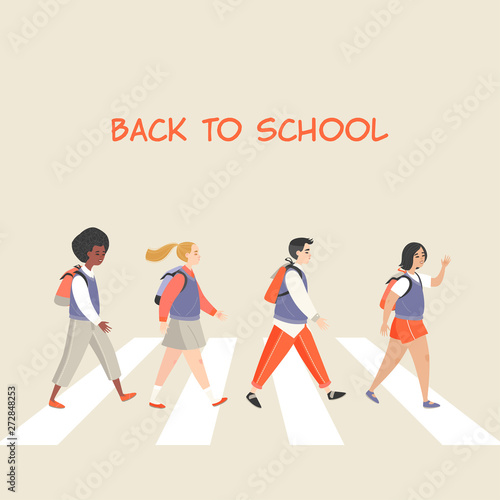 Pupils of different gender and nationalities going to school. A group of children crossing the road.