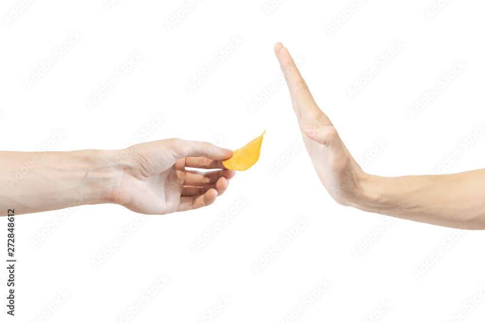 Say no potato chips. Man says no to potato chips. Hand gesture to