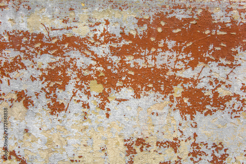 old shabby gray white concrete wall with scratches and brown red peeling paint. rough surface texture © Pavel