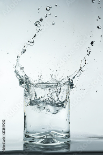 Splash in a glass on white