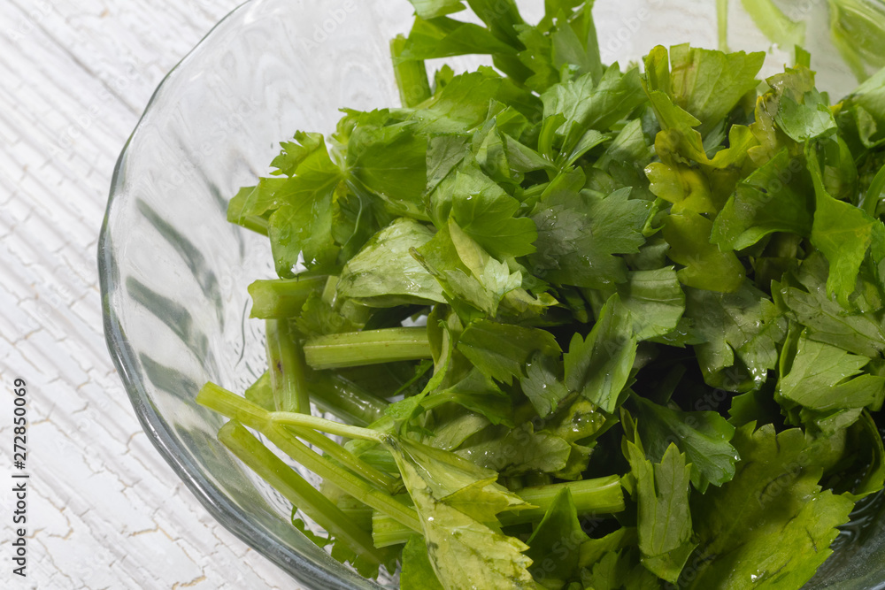 slide of Fresh celery plant on glass bowl slide of Fresh celery plant on glass bowl
