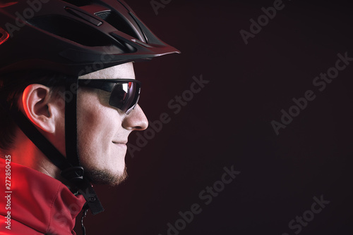 cycllist. young man in cycling helmet. copy space. photo