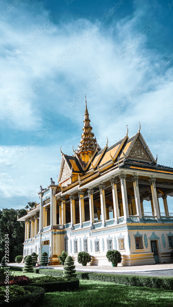 The stunning Royal Palace (& Silver Pagoda) architecture with a beautiful clear and dynamic blue sky, located at the city of Phnom Penh, Cambodia.